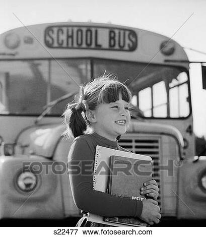 1980S Girl Holding Books Standing In Front Of School Bus View Large Photo Image Stock Photo - 1980S Girl Holding Books Standing In Front Of School Bus. Fotosearch