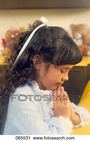 Stock Image - 1980S Little Girl Praying Bedside Bedtime. Fotosearch