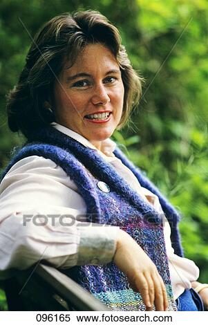 1980S Portrait Of Smiling Woman Wearing Sweater Vest Jacket Outdoors View Large Photo Image Stock Photography - 1980S Portrait Of Smiling Woman Wearing Sweater Vest Jacket Outdoors. Fotosearch