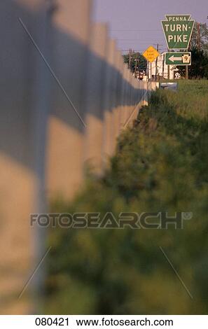 Stock Image - 1980S Traffic Sign Pointing Direction To Pennsylvania Turnpike Usa. Fotosearch