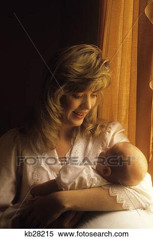 Stock Photography - 1990S Mother Holding Baby. Fotosearch