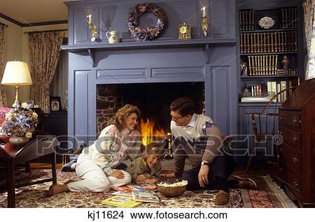 Family Sitting By Fireplace View Large Photo Image Picture - Family Sitting By Fireplace . Fotosearch