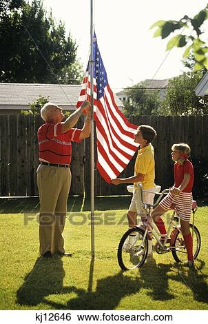 Grandfather Raising Flag On Pole Two Grandchildren Watching View Large Photo Image Stock Photograph - Grandfather Raising Flag On Pole Two Grandchildren Watching . Fotosearch