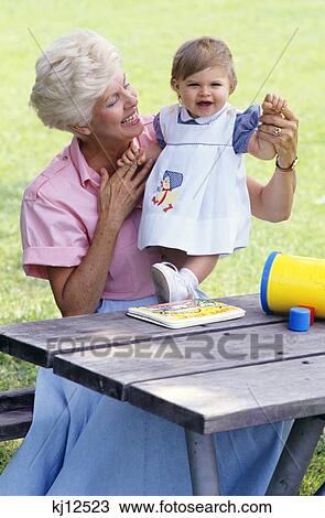 Grandmother And Granddaughter At Picnic Table View Large Photo Image Stock Image - Grandmother And Granddaughter At Picnic Table . Fotosearch
