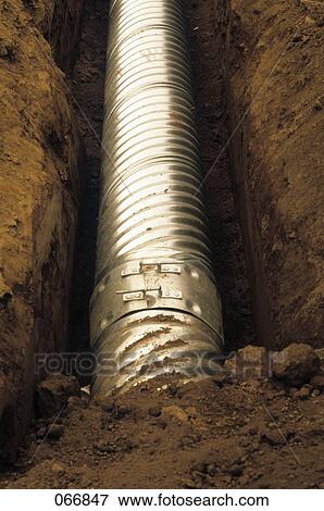 Newly Laid Metal Pipe In Ditch View Large Photo Image Stock Photo - Newly Laid Metal Pipe In Ditch. Fotosearch