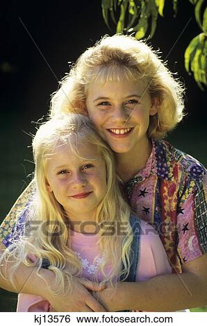 Portrait Of Two Girls Outdoors View Large Photo Image Stock Photograph - Portrait Of Two Girls Outdoors . Fotosearch