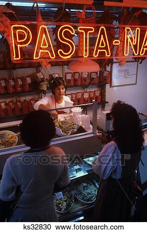 Woman Waiting On Customers At A Pasta Shop At Chestnut Hill Farmers Market Manayunk Philadelphia Pennsylvania View Large Photo Image Stock Image - Woman Waiting On Customers At A Pasta Shop At Chestnut Hill Farmers Market Manayunk Philadelphia Pennsylvania . Fotosearch