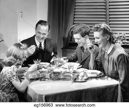 1930S 1940S Happy Family Eating Dinner At Home View Large Photo Image Stock Image - 1930S 1940S Happy Family Eating Dinner At Home. Fotosearch