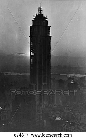 1930S Construction Nearly Complete On Empire State Building Sun Shining Thru Skeleton Of Structure June 1931 View Large Photo Image Stock Photo - 1930S Construction Nearly Complete On Empire State Building Sun Shining Thru Skeleton Of Structure June 1931. Fotosearch