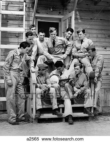 1940S Group Of Soldier Sitting On Steps Of Barracks Listening To Man Playing Banjo View Large Photo Image Stock Photography - 1940S Group Of Soldier Sitting On Steps Of Barracks Listening To Man Playing Banjo . Fotosearch