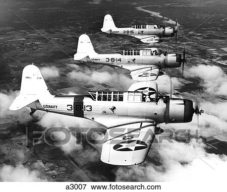 Stock Photo - 1940S Three World War Ii Us Navy Dive Bombers Flying In Formation. Fotosearch