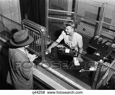 1940S Woman Bank Teller Behind Cage Serving Male Customer View Large Photo Image Stock Photo - 1940S Woman Bank Teller Behind Cage Serving Male Customer. Fotosearch