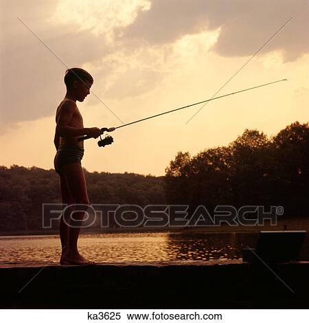 1950S 1960S Boy Standing Lakeside Holding A Fishing Rod Wearing Bathing Suit Sunset Silhouetted View Large Photo Image Stock Photography - 1950S 1960S Boy Standing Lakeside Holding A Fishing Rod Wearing Bathing Suit Sunset Silhouetted . Fotosearch