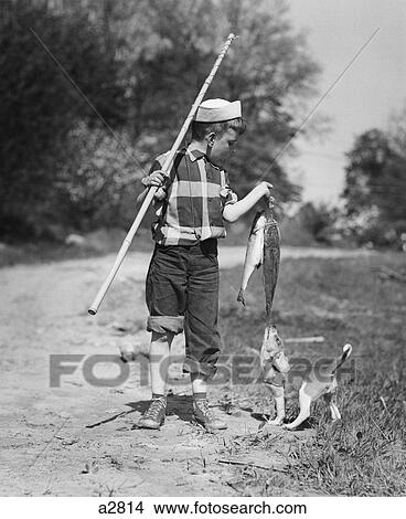 1950S Boy Plaid Shirt Sailor Hat Fishing Pole Dog Pulling On Tail Of Caught Fish View Large Photo Image Picture - 1950S Boy Plaid Shirt Sailor Hat Fishing Pole Dog Pulling On Tail Of Caught Fish . Fotosearch