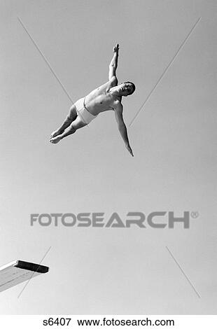 1950S Man Twisting Swan Diving From High Diving Board Outdoor View Large Photo Image Stock Photo - 1950S Man Twisting Swan Diving From High Diving Board Outdoor. Fotosearch