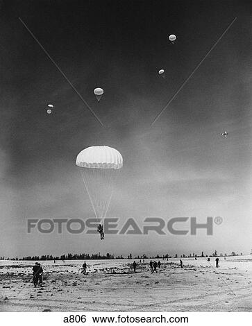 1950S Training Soldiers Parachuting Onto Naval Base Field View Large Photo Image Stock Photograph - 1950S Training Soldiers Parachuting Onto Naval Base Field . Fotosearch