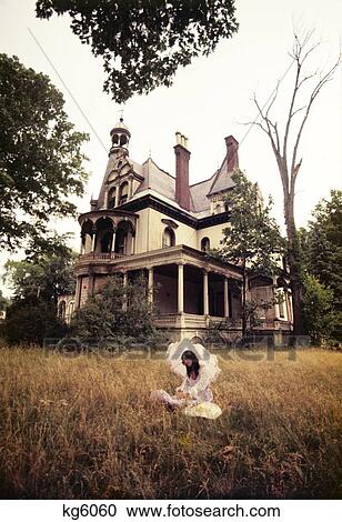 1960S 1970S Woman Under Parasol Sitting Front Of Abandoned Haunted Victorian House View Large Photo Image Stock Image - 1960S 1970S Woman Under Parasol Sitting Front Of Abandoned Haunted Victorian House. Fotosearch