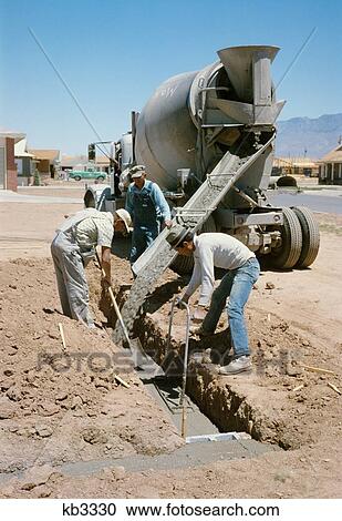 1960S 3 Workers Pouring Concrete For Foundation Of House In Albuquerque New Mexico View Large Photo Image Stock Image - 1960S 3 Workers Pouring Concrete For Foundation Of House In Albuquerque New Mexico . Fotosearch