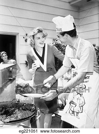 1960S Laughing Couple Backyard Bbq Grill View Large Photo Image Stock Image - 1960S Laughing Couple Backyard Bbq Grill . Fotosearch