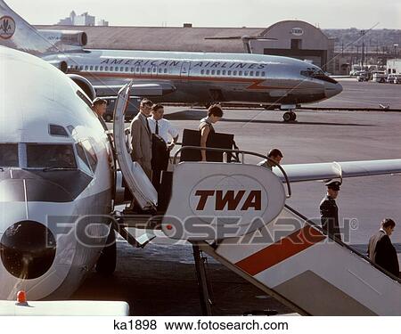 1960S Passengers Deplaning Boeing 727 Twa Jet Newark Airport New Jersey View Large Photo Image Stock Photo - 1960S Passengers Deplaning Boeing 727 Twa Jet Newark Airport New Jersey . Fotosearch