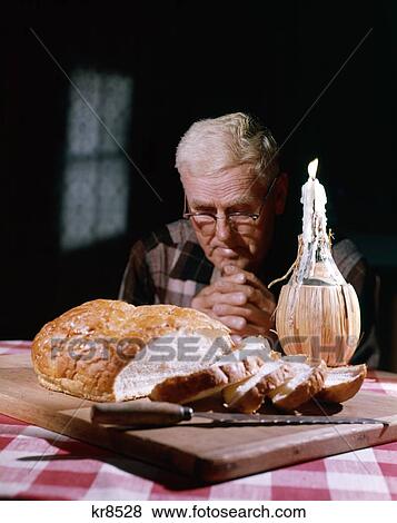 1960S Retro Man Prayer Pray Bread Grace Candle Cutting Board Table Cloth View Large Photo Image Stock Photo - 1960S Retro Man Prayer Pray Bread Grace Candle Cutting Board Table Cloth . Fotosearch