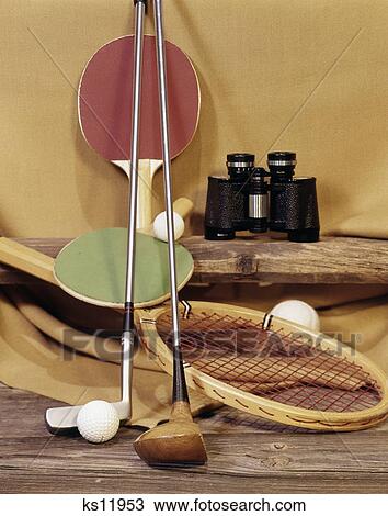 Stock Image - 1960S Tennis Racket Racquet Table Tennis Ping Pong Paddles Golf Clubs Putter Wood Driver Binoculars . Fotosearch