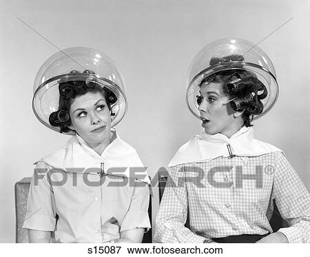 1960S Two Women Sitting Under Salon Hairdryers Gossiping Talking View Large Photo Image Stock Photo - 1960S Two Women Sitting Under Salon Hairdryers Gossiping Talking . Fotosearch