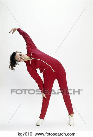 Stock Image - 1970S Girl Exercising In Red Gym Jump Suit. Fotosearch