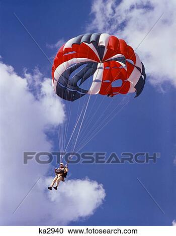 1970S Parachutist In Sky Red White Blue Parachute Yellow Jumpsuit View Large Photo Image Stock Image - 1970S Parachutist In Sky Red White Blue Parachute Yellow Jumpsuit . Fotosearch
