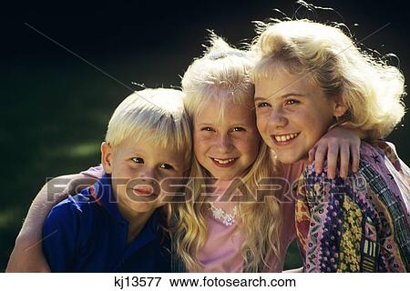 1980S 1990S Portrait One Boy And Two Girls Outdoors View Large Photo Image Stock Photo - 1980S 1990S Portrait One Boy And Two Girls Outdoors . Fotosearch