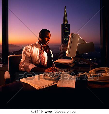 1980S African American Man Executive Working At Computer After Hours San Francisco Ca Usa View Large Photo Image Stock Photo - 1980S African American Man Executive Working At Computer After Hours San Francisco Ca Usa. Fotosearch