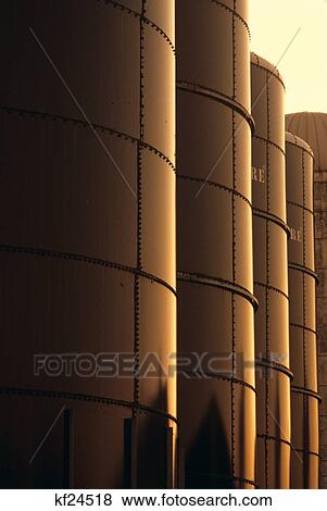 Stock Photo - 1980S Detail Of Grain And Feed Silos Reflecting Golden Sun. Fotosearch