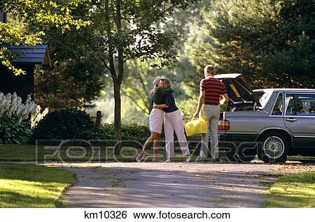 1980S People Leaving On Trip Saying Goodbye View Large Photo Image Stock Photograph - 1980S People Leaving On Trip Saying Goodbye . Fotosearch