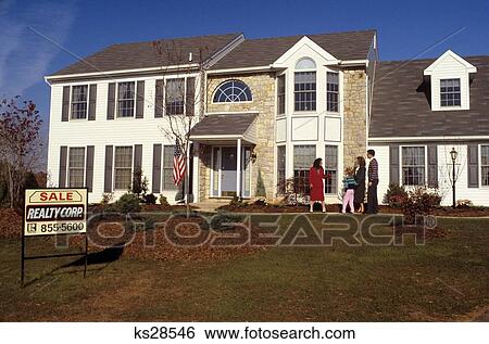 1980S Realtor Showing Family Outside Of House For Sale View Large Photo Image Stock Photograph - 1980S Realtor Showing Family Outside Of House For Sale . Fotosearch