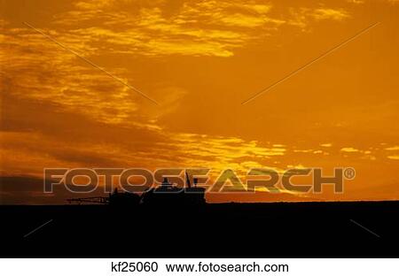 1980S Silhouette Of Tractor On Farm At Sunset View Large Photo Image Stock Image - 1980S Silhouette Of Tractor On Farm At Sunset. Fotosearch