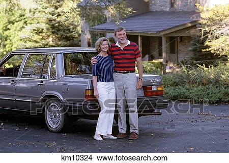 1980S Smiling Couple In Driveway With Car View Large Photo Image Picture - 1980S Smiling Couple In Driveway With Car . Fotosearch