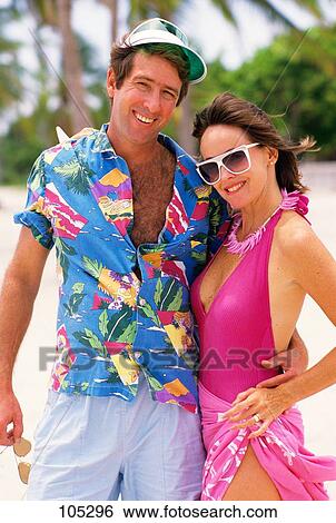 1980S Young Couple Outdoors Tropical Island Looking At Camera View Large Photo Image Stock Photograph - 1980S Young Couple Outdoors Tropical Island Looking At Camera. Fotosearch
