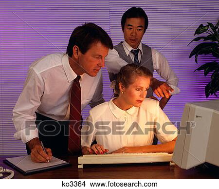 Picture - 1990S Business People Working Together At Desktop Computer . Fotosearch