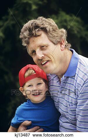 Stock Photo - 1990S Close-Up Of Father And Son Outdoors . Fotosearch