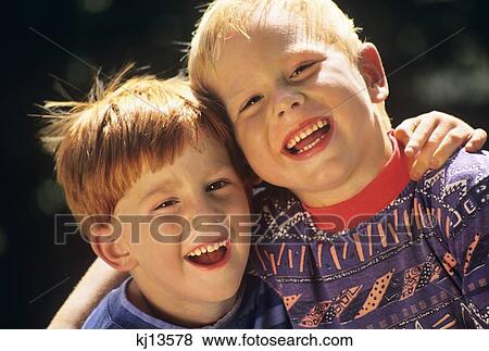 1990S Portrait Two Boys Smiling Laughing Looking At Camera View Large Photo Image Stock Photo - 1990S Portrait Two Boys Smiling Laughing Looking At Camera. Fotosearch