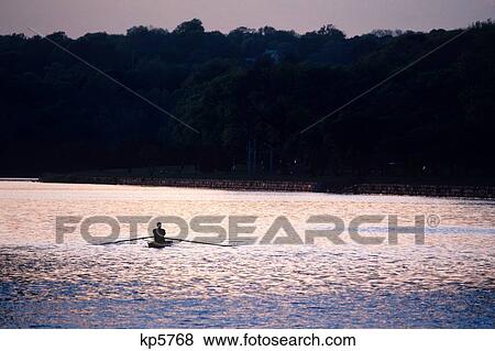 Stock Photo - 1990S Single Shell Rowing On Schuylkill River In Fairmount Park At Dusk Philadelphia Pennsylvania Usa. Fotosearch