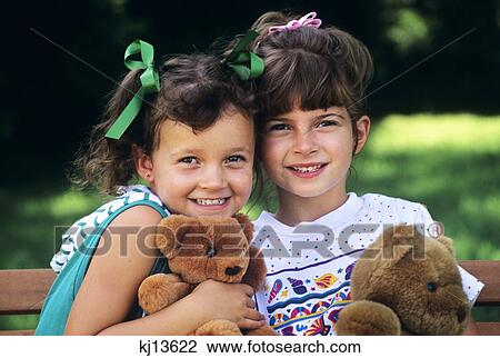 1990S Two Brunette Girls Sisters Together With Teddy Bears Looking At Camera View Large Photo Image Stock Image - 1990S Two Brunette Girls Sisters Together With Teddy Bears Looking At Camera . Fotosearch