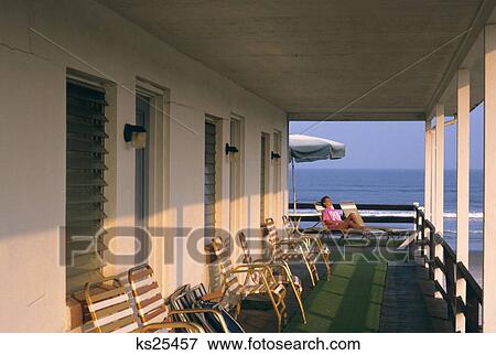 1990S Woman Relaxing On Chaise On Seaside Balcony Stone Harbor Nj View Large Photo Image Stock Photo - 1990S Woman Relaxing On Chaise On Seaside Balcony Stone Harbor Nj . Fotosearch
