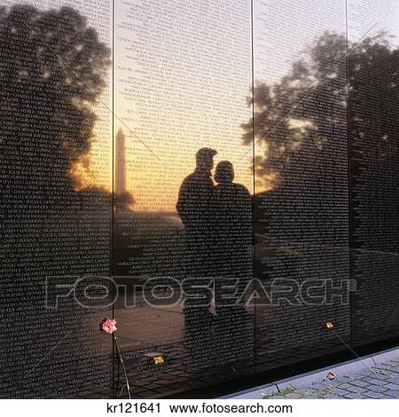 2000S Couple Man And Woman At Sunrise Reflected In Vietnam Memorial The Wall At National Mall Washington Dc Usa View Large Photo Image Stock Image - 2000S Couple Man And Woman At Sunrise Reflected In Vietnam Memorial The Wall At National Mall Washington Dc Usa. Fotosearch