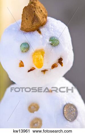 Stock Image - Edible Snowman For The Birds With A Dime Rittenhouse Square Philadelphia Pennsylvania . Fotosearch