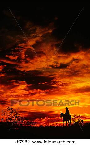 Stock Image - Man On Horse. Fotosearch