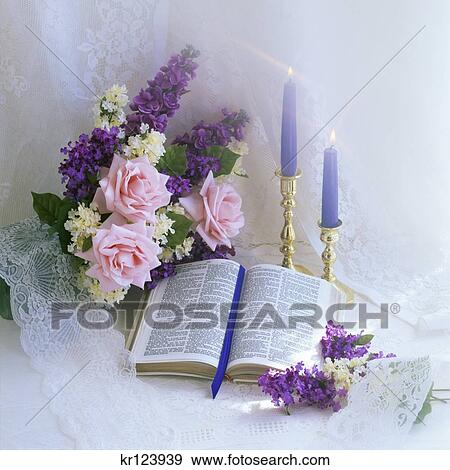 Open Bible Blue Candles And Bouquet Of Pink And Purple Flowers View Large Photo Image Stock Photo - Open Bible Blue Candles And Bouquet Of Pink And Purple Flowers . Fotosearch