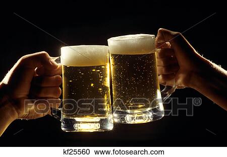 Two Male Hands Toasting With Full Beer Mugs View Large Photo Image Stock Image - Two Male Hands Toasting With Full Beer Mugs . Fotosearch