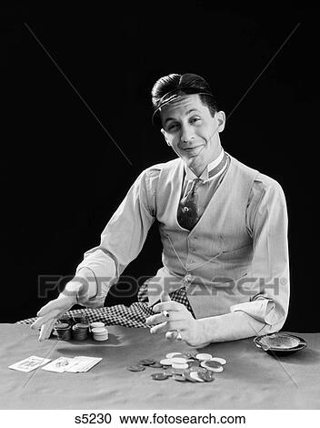 1910S 1920S Character Man Gambler Card Sharp Shark Smiling Wearing Visor Shows His Cards And Bets Poker Chips View Large Photo Image Stock Image - 1910S 1920S Character Man Gambler Card Sharp Shark Smiling Wearing Visor Shows His Cards And Bets Poker Chips . Fotosearch