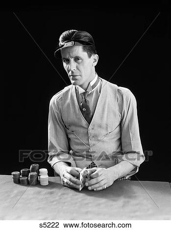 1910S 1920S Character Man Gambler Dealer Wearing Visor Shuffling Deck Cards With Poker Chips Card Shark Sharp View Large Photo Image Stock Image - 1910S 1920S Character Man Gambler Dealer Wearing Visor Shuffling Deck Cards With Poker Chips Card Shark Sharp . Fotosearch